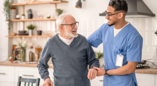 an allied healthcare professional speaking with a male patient during Men’s Health Month