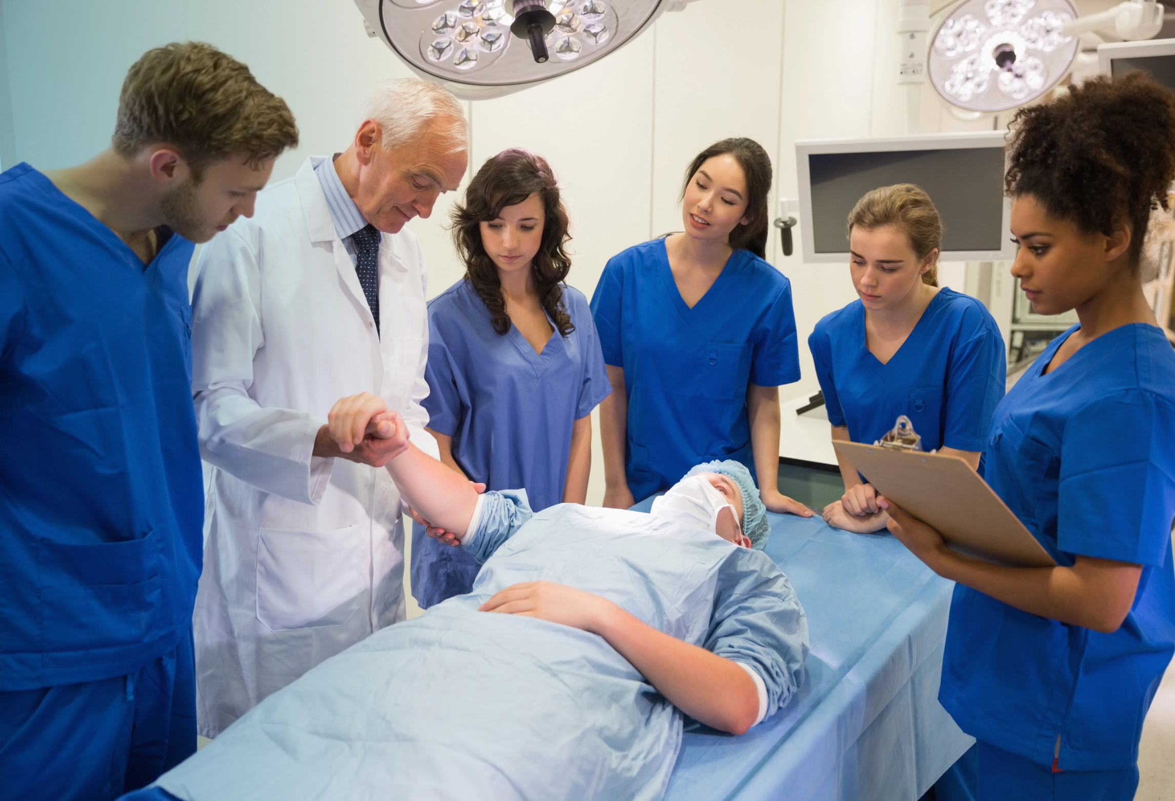 A healthcare professional reviews documents in a medical setting