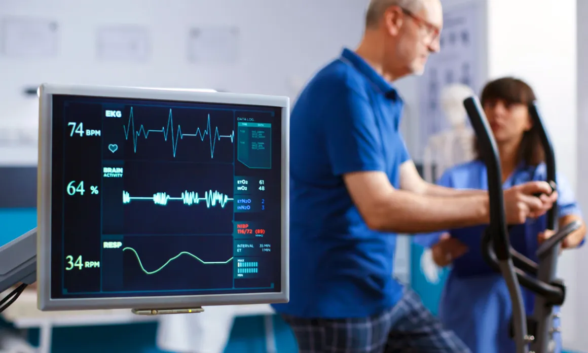 Cardiovascular technology professional working with a patient