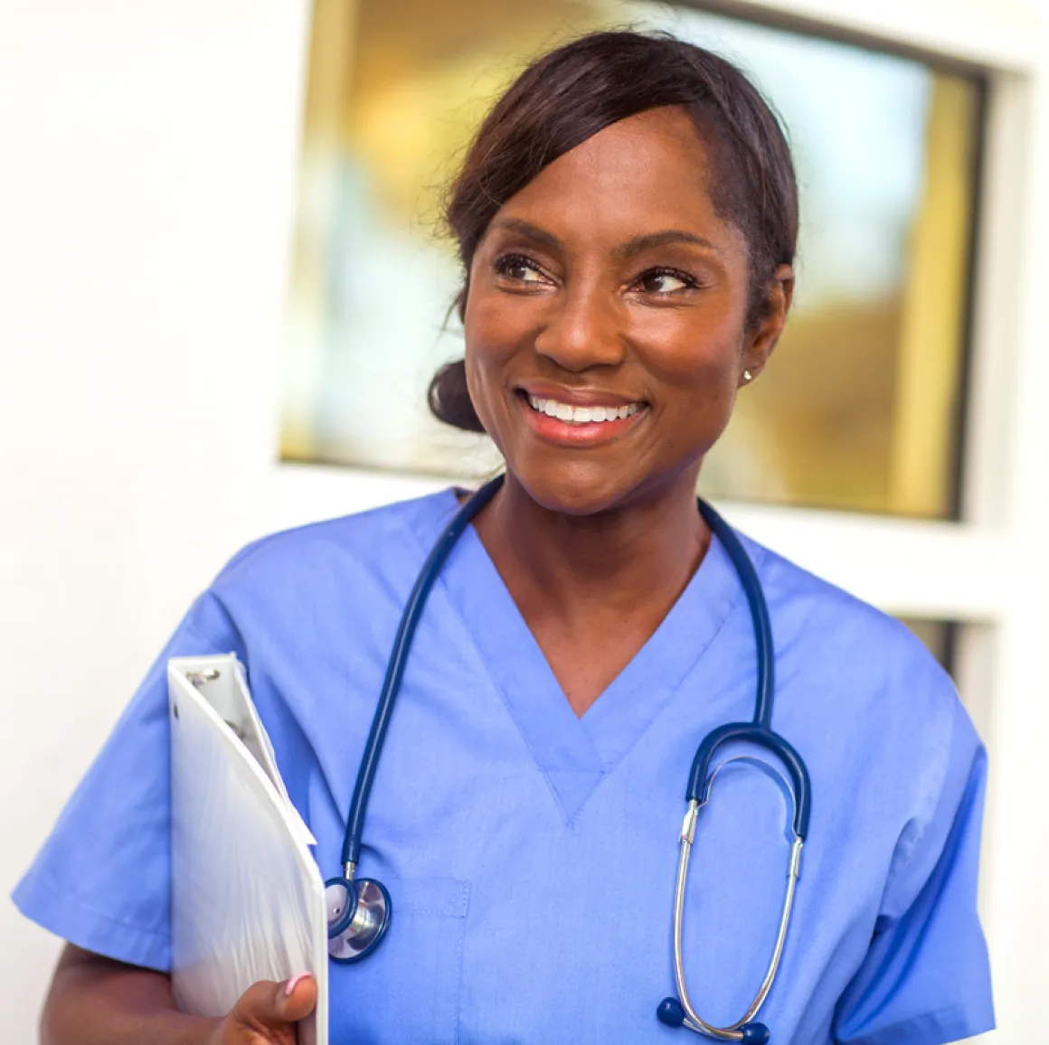 Two cardiovascular technology professionals working with a patient