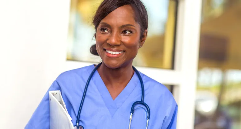 Two cardiovascular technology professionals working with a patient