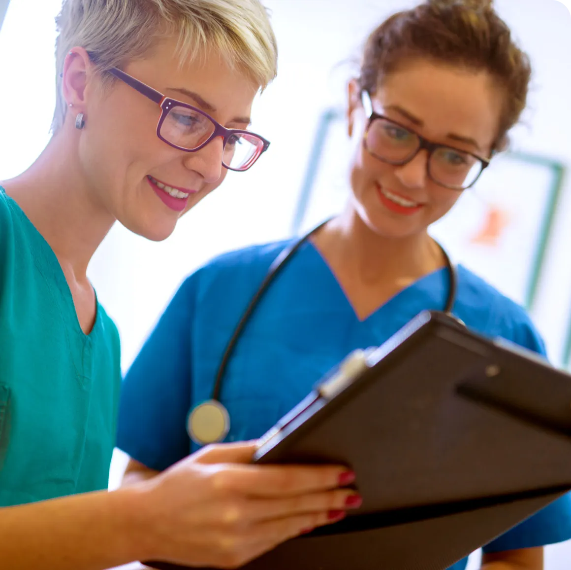 Two cardiovascular technology professionals reviewing a chart