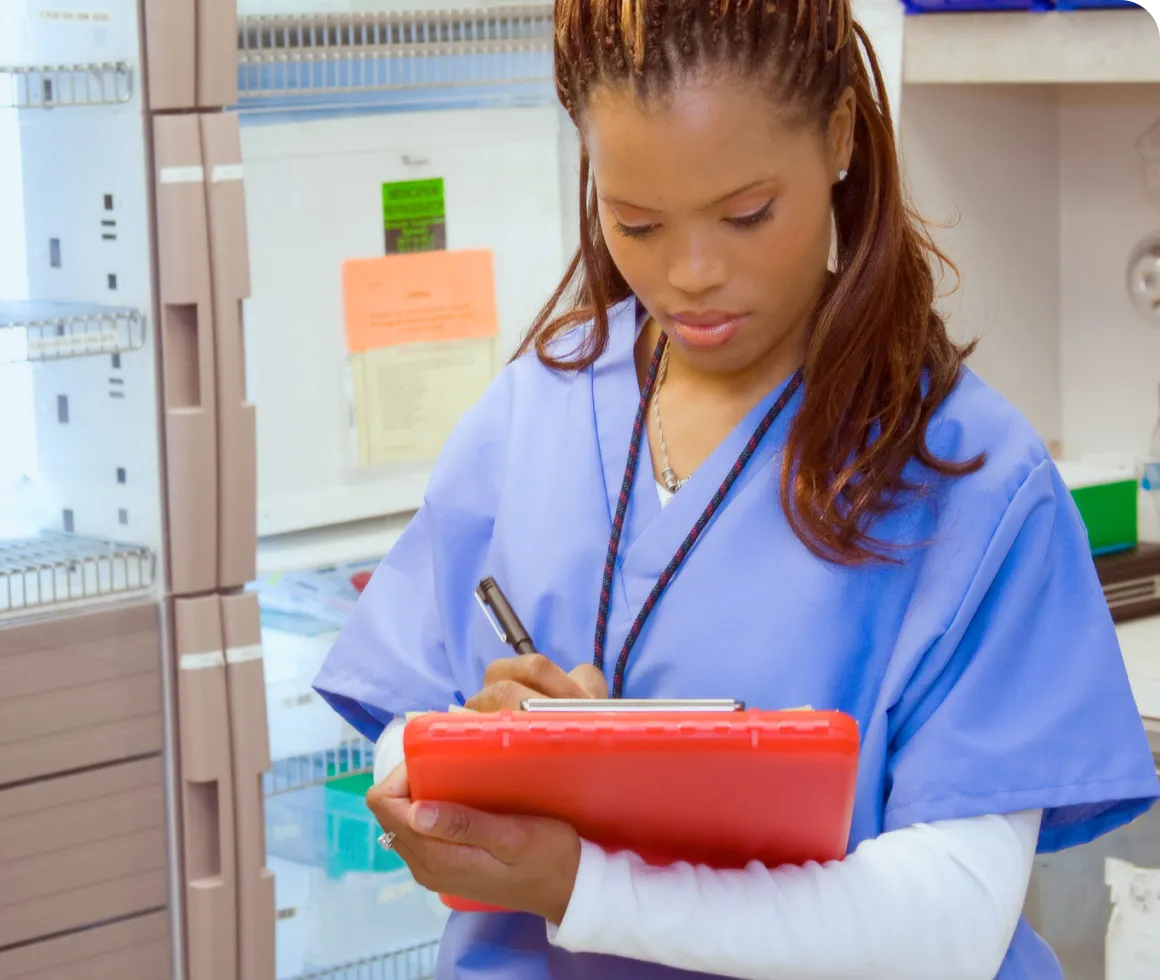 A healthcare professional charting notes
